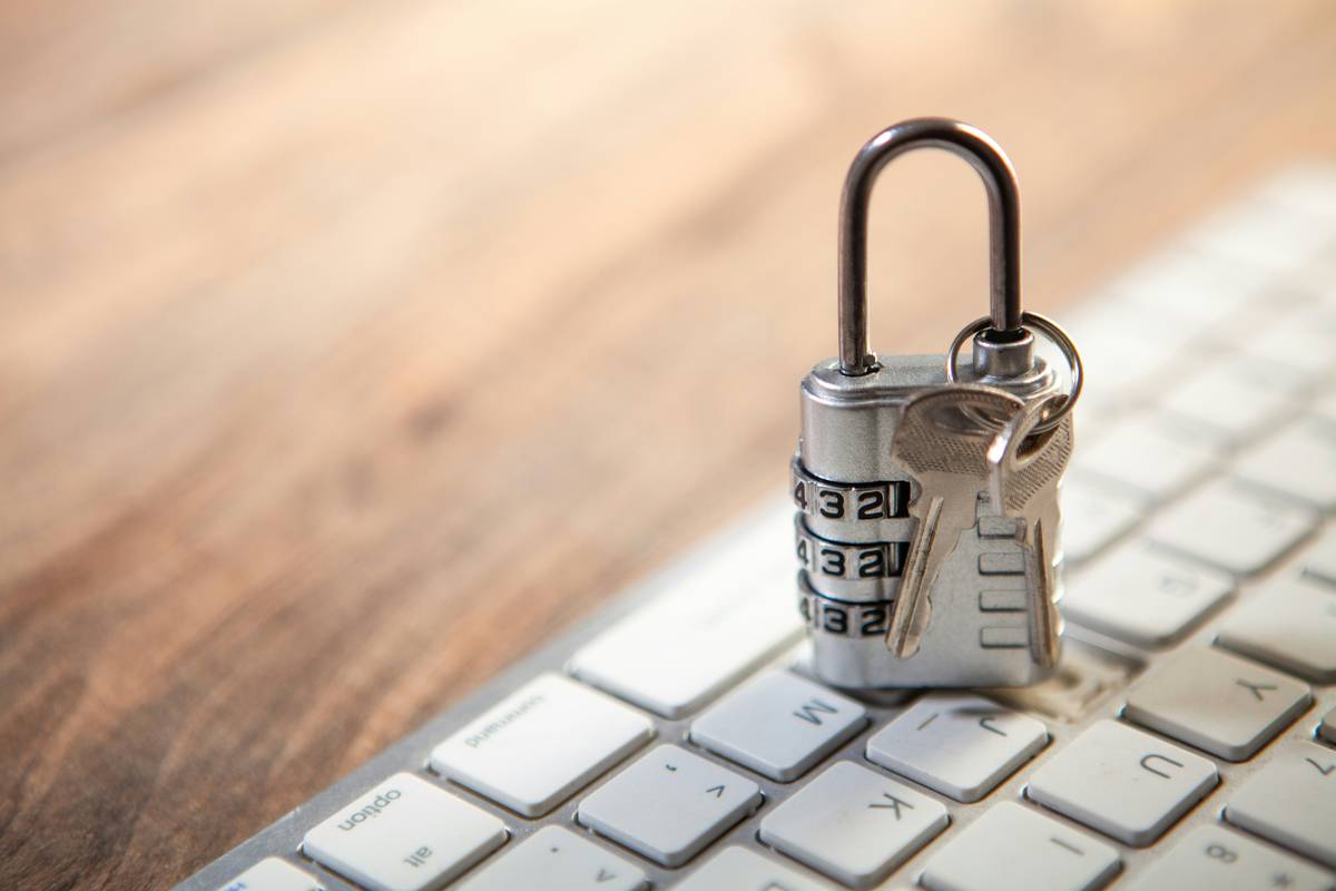 Key for password management: illustrated concept showing a digital key unlocking multiple secure password vaults